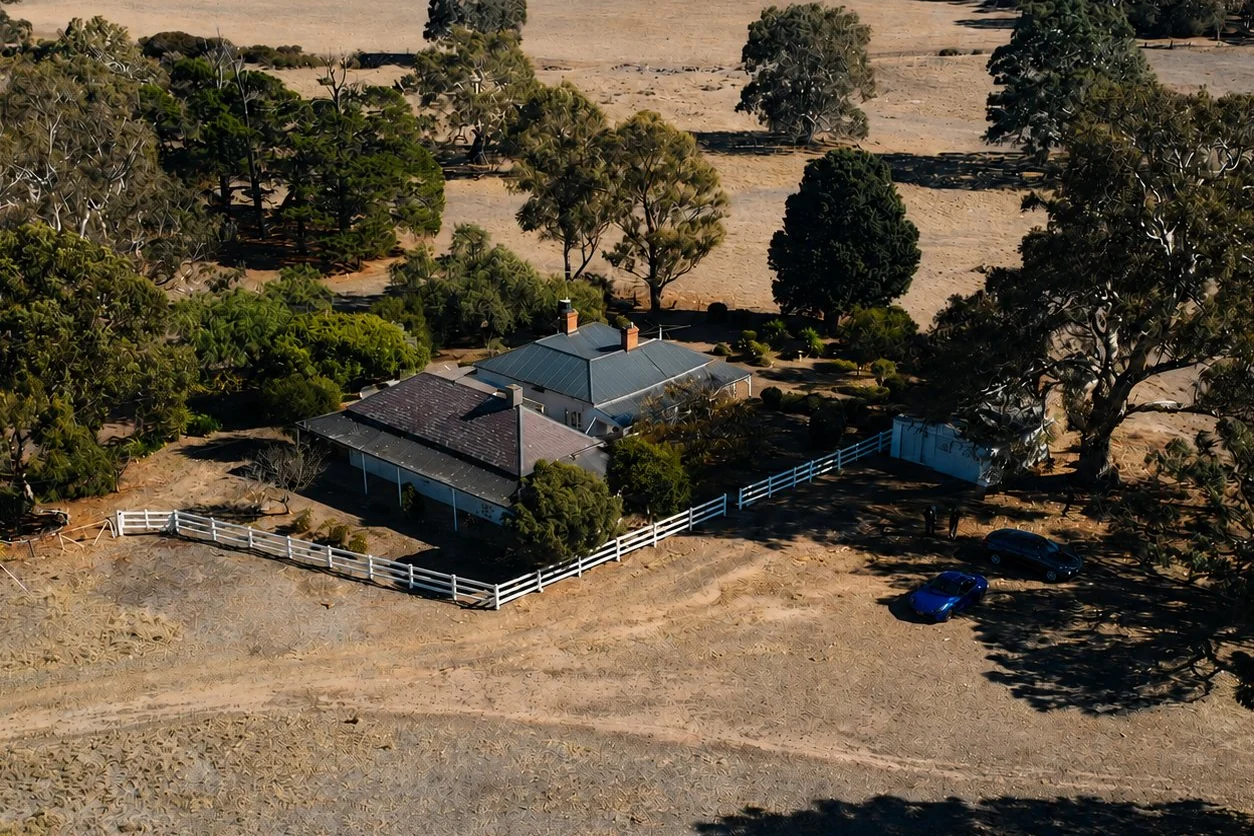 Aerial drone view of an acreage homestead and surrounding land in rural Victoria