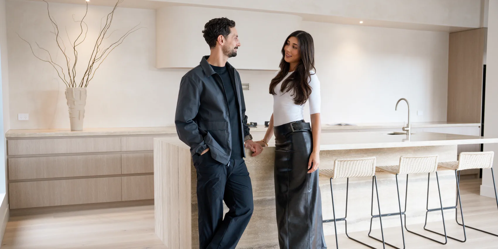 Couple in the kitchen of their finished luxury home during a cinematic property video shoot in Melbourne