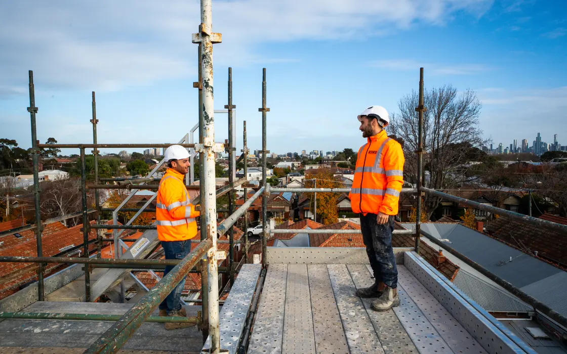 Holmes Plumbing team on the scaffold of a Prahran townhouse development