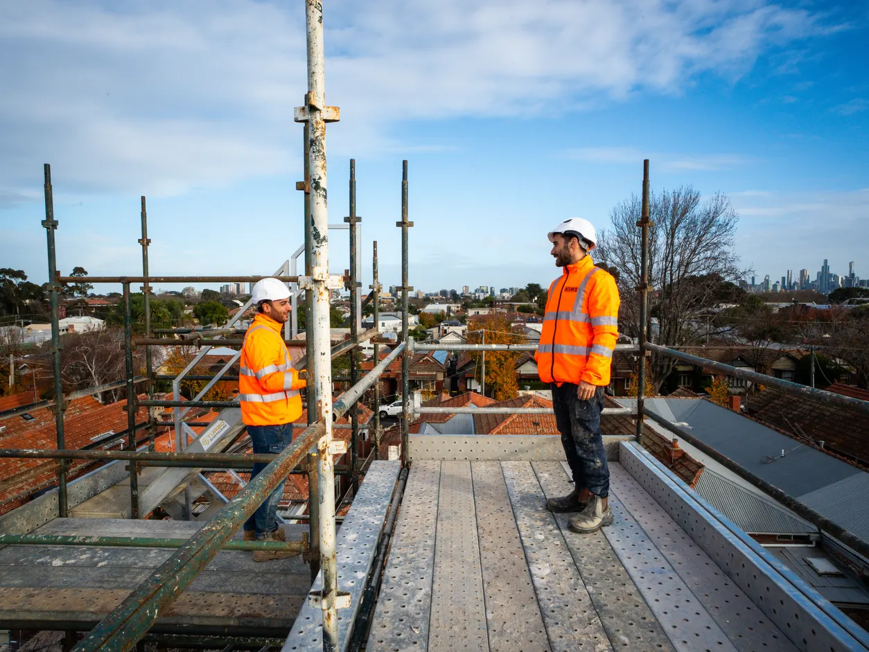 Holmes Plumbing team on the scaffold above the Prahran development