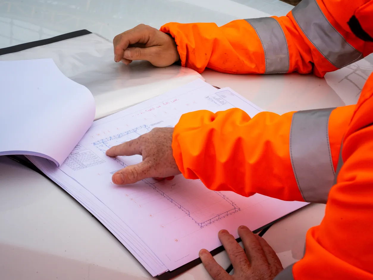 Close up of plumbing plans being reviewed