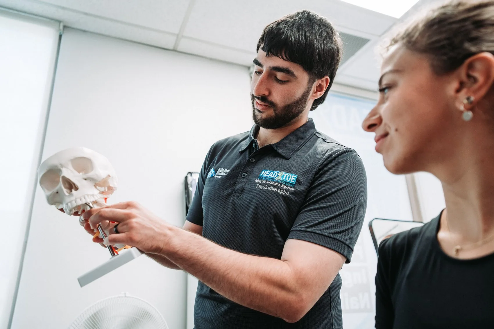 Head 2 Toe practitioner explaining anatomy to a patient
