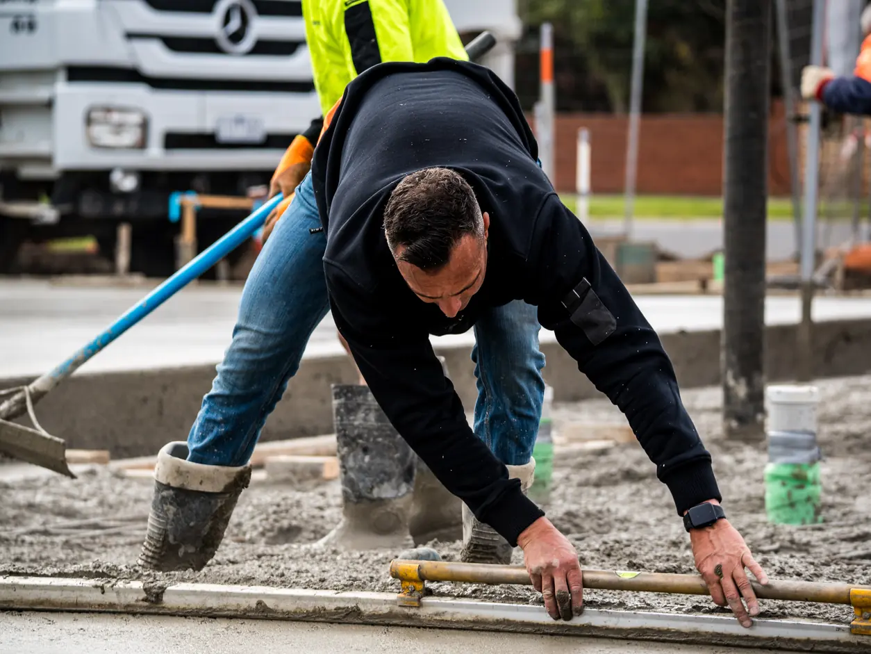 Screeding the slab during the pour